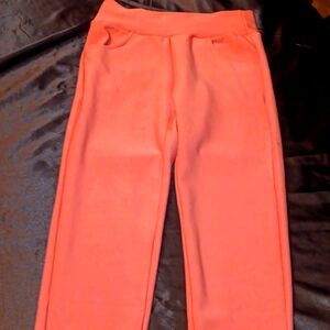 Pink dress legging with pockets in front and back. Size small.